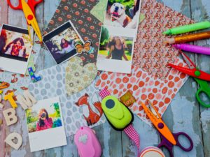 assorted scrapbooking tools and papers