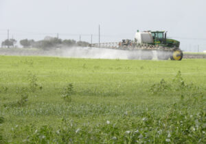 tractor spraying pasture