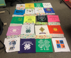 t-shirt squares laid out to make a quilt