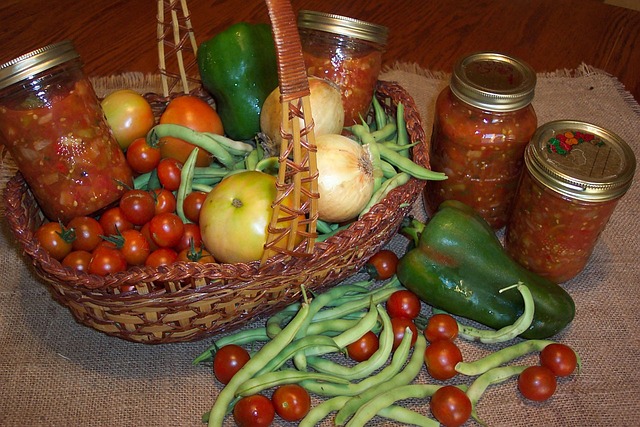 basket of vegetables and jars of home canned food 