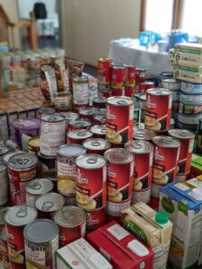 canned foods stacked on tables